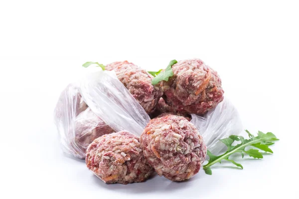 Frozen raw meatballs from beef and pork with carrots and rice — Stock Photo, Image