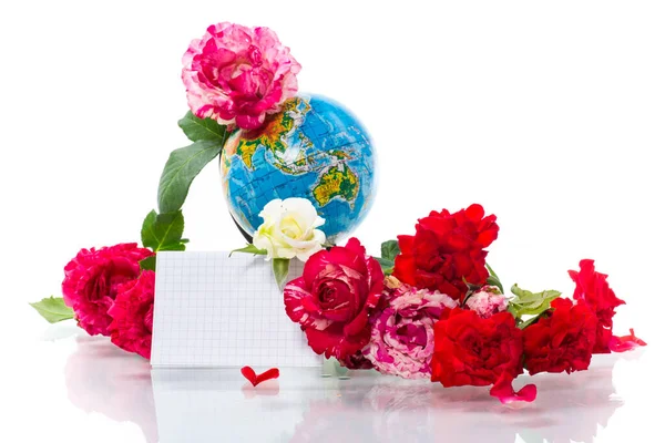 Globe with books and flowers on a white background
