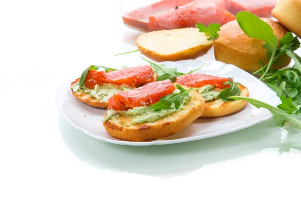 Sandwich with fried bun, cheese spread and red fish in a plate — Stock Photo, Image