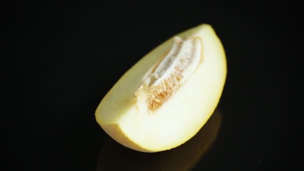 Studio shot of notched ripe melon galia with slice — Stok Video