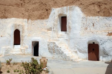 Underground dwellings of troglodytes in the Atlas Mountains. Sahara. Tunisia. Africa. clipart