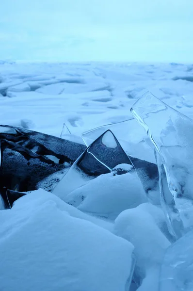 the sun\'s rays are refracted in crystal clear pieces of ice. winter landscape. Lake Baikal