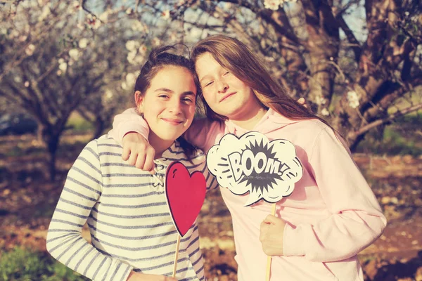 Two Teenage Girlfriends Holding Boom Shape Heart Shape — Stock Photo, Image