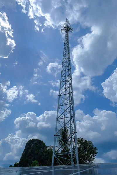 Contract mobile towers cloud sky backgruond, communications tower and solar panels that supply of electricity in local Thailand