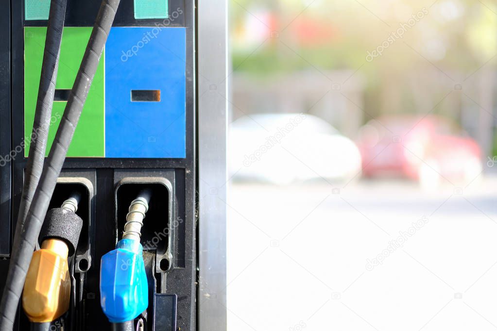 Petrol pump filling nozzles background , Gas station in a service, transport and business concept