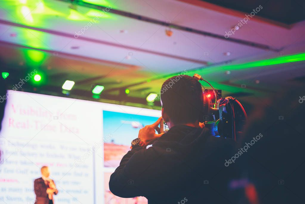 Seminar training workshop event video camera field working recorder commercial production to blurred Spokespersons talk