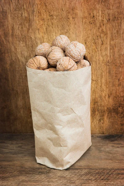 Walnuts Paper Bags Background Old Wooden Board — Stock Photo, Image