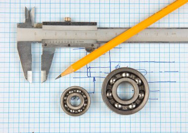 Çap pergeli, rulman ve arka plan grafik kağıt üzerine Meydanı
