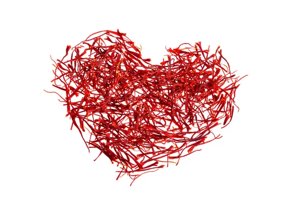 Saffrons silhouette of the heart. Delicate saffron threads, plucked from crocus flowers and dried. Isolated on white background — Stock Photo, Image