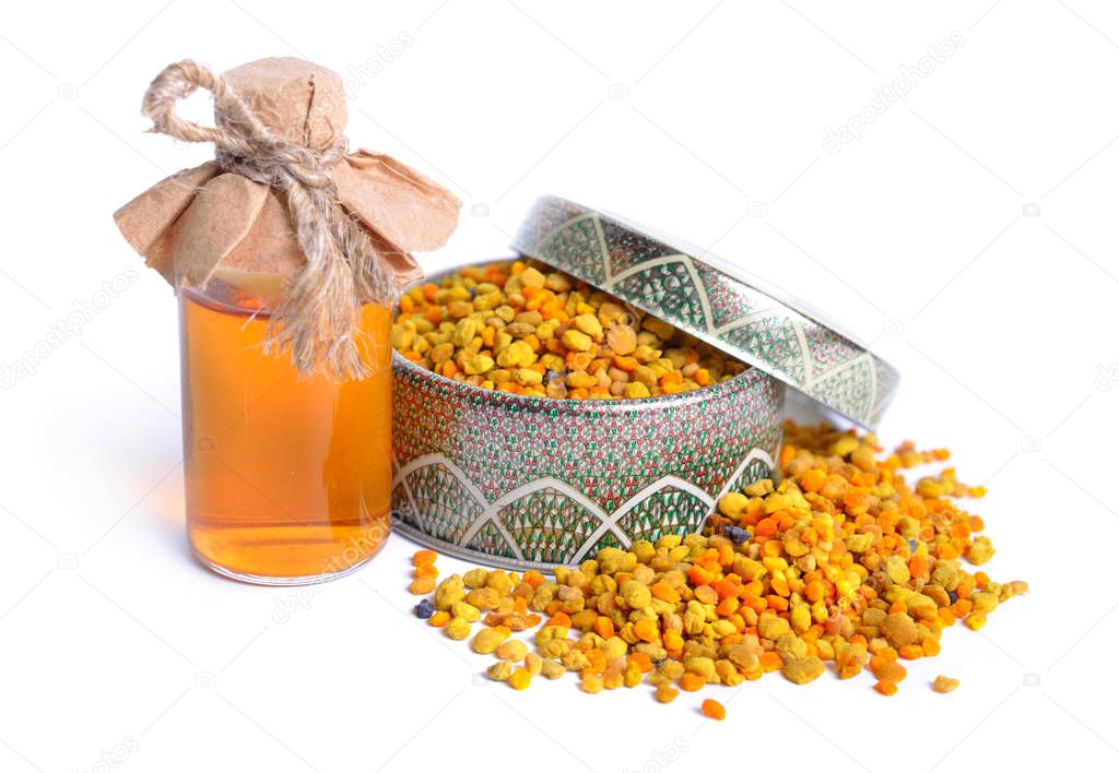 Bee pollen baskets with pharmaceutical bottle. Isolated on white background