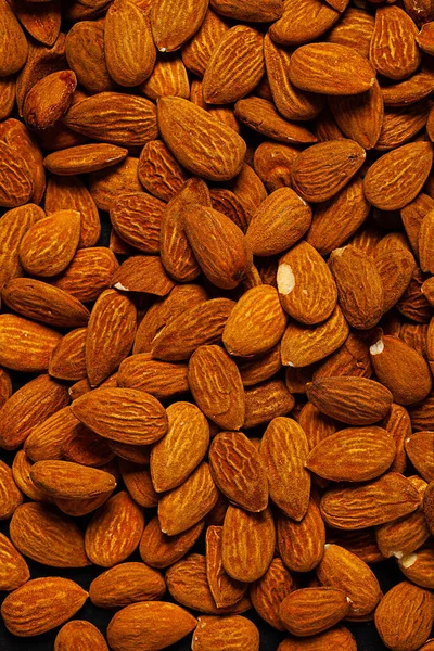 Background Big Raw Peeled Almonds Situated Arbitrarily — Stock Photo, Image