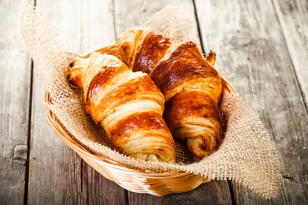 Two Tasty Oil Croissants Basket Lying Old Wooden Table — Stock Photo, Image