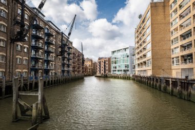 Wide-angle view of the St Saviours Dock in London from a footbridge, UK. clipart