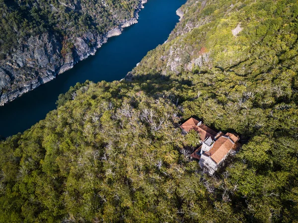 Aerial view of Santa Cristina de Ribas de Sil in early Autumn, with the canyon of the river Sil acting as the natural border between the provinces of Ourense and Lugo in the Ribeira Sacra.