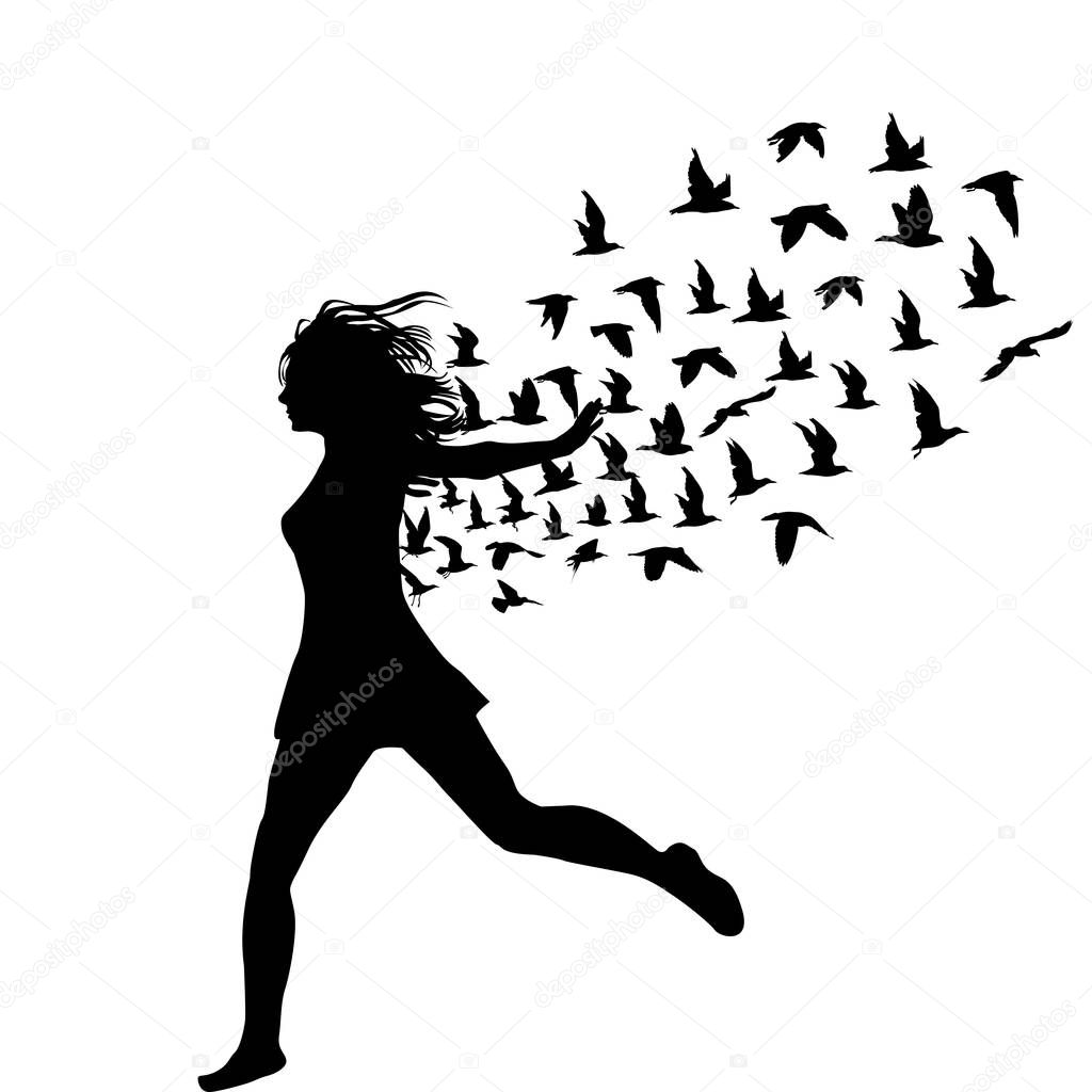 Silhouette of young woman jumping with birds flying from her 