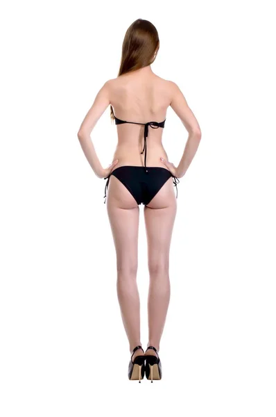 Modell tester. Vacker sexig tjej med långt hår i en svart simmar — Stockfoto