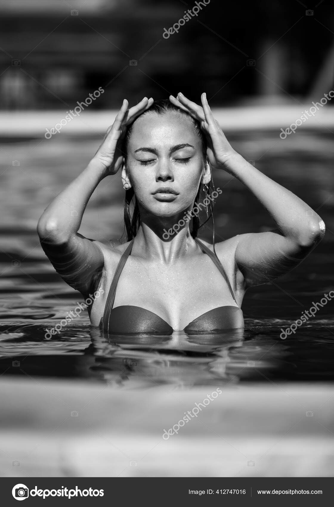 https://st4.depositphotos.com/1012146/41274/i/1600/depositphotos_412747[001-999]-stock-photo-portrait-beautiful-woman-silver-swimsuit.jpg