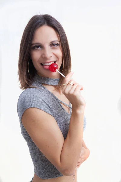 Vrouw met een lolly — Stockfoto