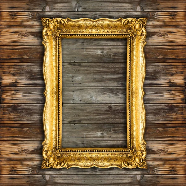 Starý zlatý rámeček obrázku na dřevěné pozadí — Stock fotografie