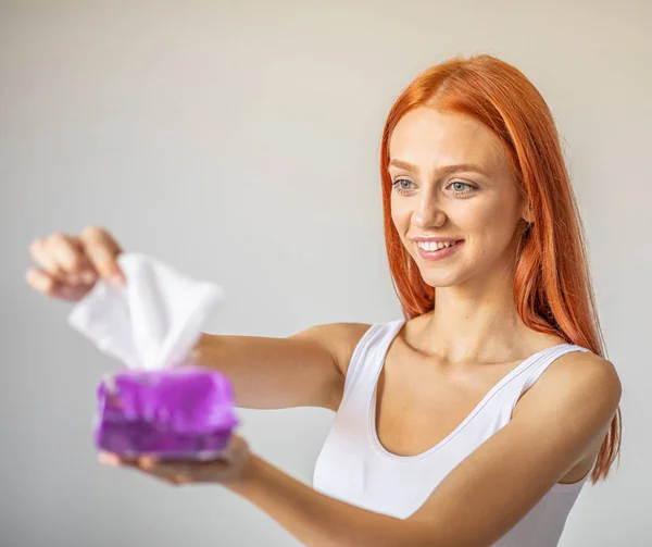 Wet wipes: women take one wipe from package for cleaning — Stock Photo, Image