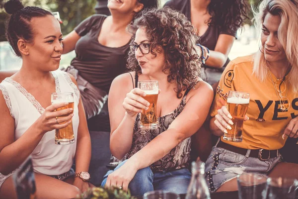 Happy female friends drinking beer - Friendship concept with you