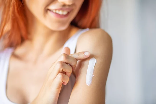 Woman applying hand cream - stock photo — Stock Photo, Image