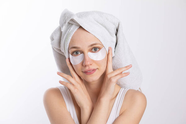 Eye Patches for Brighter, Younger-Looking Eyes, Anti-aging treatment, girl with towel on head