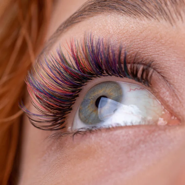 Eyelash Extension with diferent colors. Lashes. Woman Eyes with Long Eyelashes in diferent color.