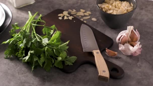Fresh Garden Herbs Kitchen Countertop Parsley Garlic Knife Almons Concept — Stock Video