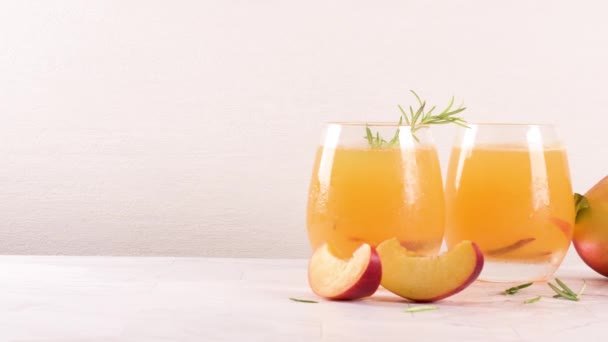 Homemade Peach Juice Ice Cubes Rosemary Leaves Glass Marble Stone — Stock Video