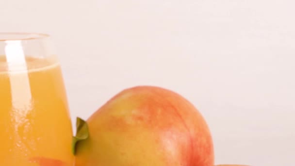 Homemade Peach Juice Ice Cubes Rosemary Leaves Glass Marble Stone — Stock Video