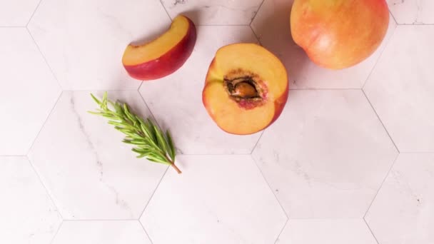 Homemade Peach Juice Ice Cubes Rosemary Leaves Glass Marble Stone — Stock Video