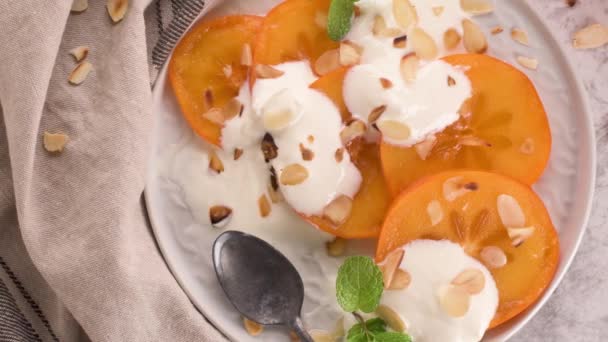 Sliced Persimon Yogurt Almonds Healthy Food Concept Light Background — Stock Video