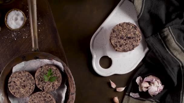 Raw Veggie Burger Black Beans Parsley Leaves Wood Countertop — Stock Video