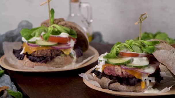 Healthy Vegan Burger Fresh Vegetables Yogurt Sauce Rustic Kitchen Counter — Stock Video