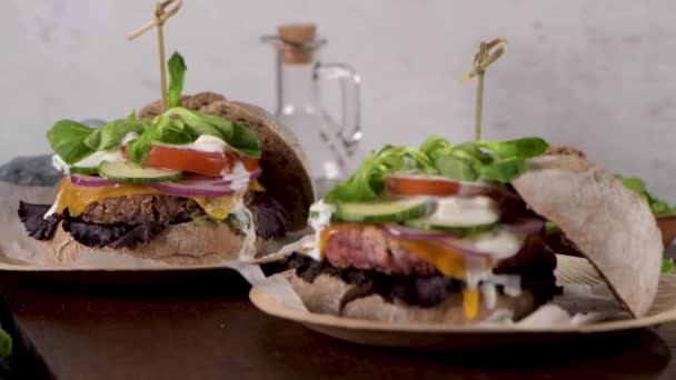 Healthy Vegan Burger Fresh Vegetables Yogurt Sauce Rustic Kitchen Counter — Stock Video