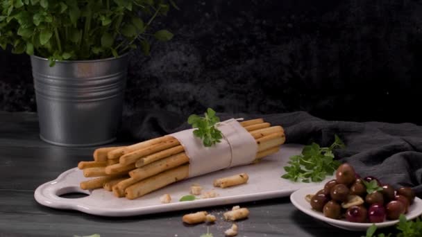 Fresh Baked Homemade Grissini Bread Sticks White Ceramic Tray Olive — Stock Video