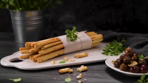 Fresh Baked Homemade Grissini Bread Sticks White Ceramic Tray Olive — Stock Video