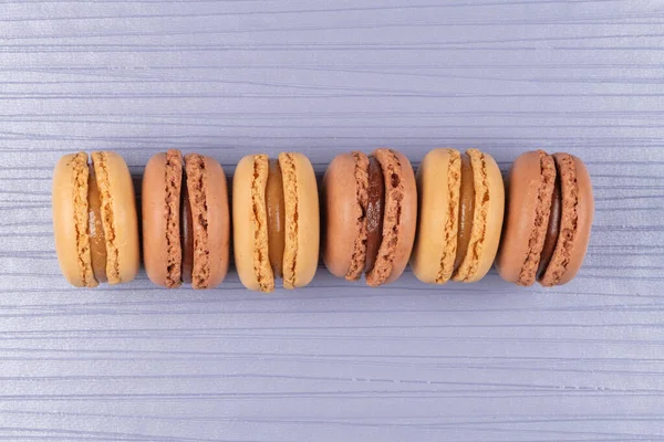 Six Coffee Chocolated Flavoured Macaroons Purple Vinyl Background — Stock Photo, Image