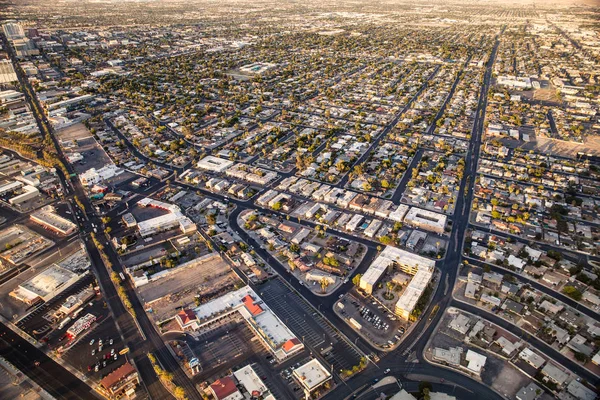 Aerial view across urban suburban communities seen from Las Vegas Nevada with streets, rooftops, and homes