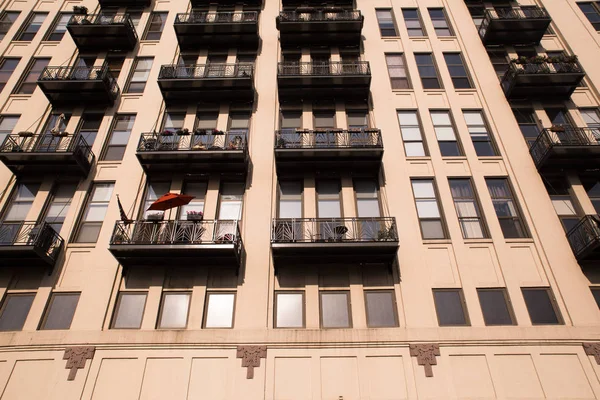 View of apartment building exterior with windows and balconies