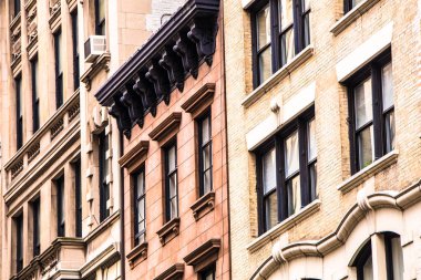 Architectural details on vintage brick apartment building in New York City clipart