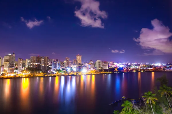 Beautiful Condado Beach, San Juan Puerto Rico seen at night with bay, buildings and lights