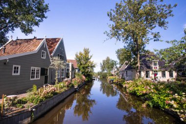 Scenic canal in the village of Broek in Waterland, North Holland, Netherlands clipart