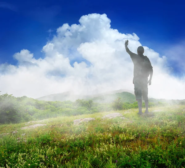 Silhouette of tourist and a beautiful landscape — Stock Photo, Image