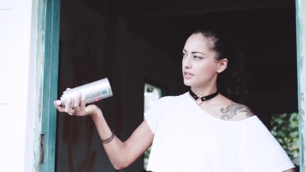 Graffiti Artist Girl Graffiti Artist Aerosol Spray Bottle Spraying Air — Stock Video