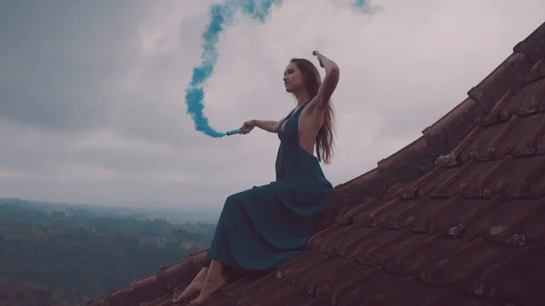 Beautiful Woman Long Dress Sitting Blue Colored Smoke Tiled Red — Stock Photo, Image