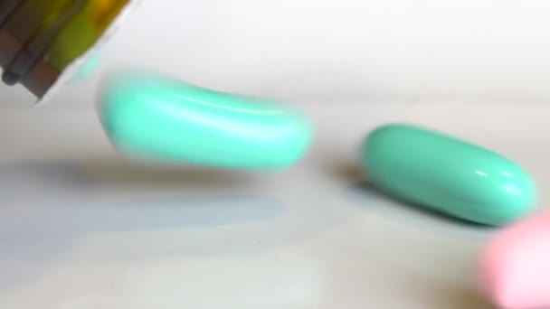 Macro Closeup Falling Herbal Pills Capsules White Table Video Slow — Stock Video