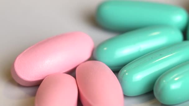 Macro Closeup Falling Herbal Pills Capsules White Table Video Slow — Stock Video