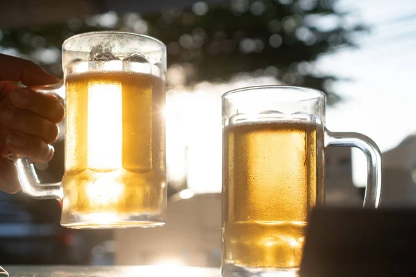 Closeup Hand Holding Fresh Lager Beer Mugs Sun Rays Hot — Stock Photo, Image